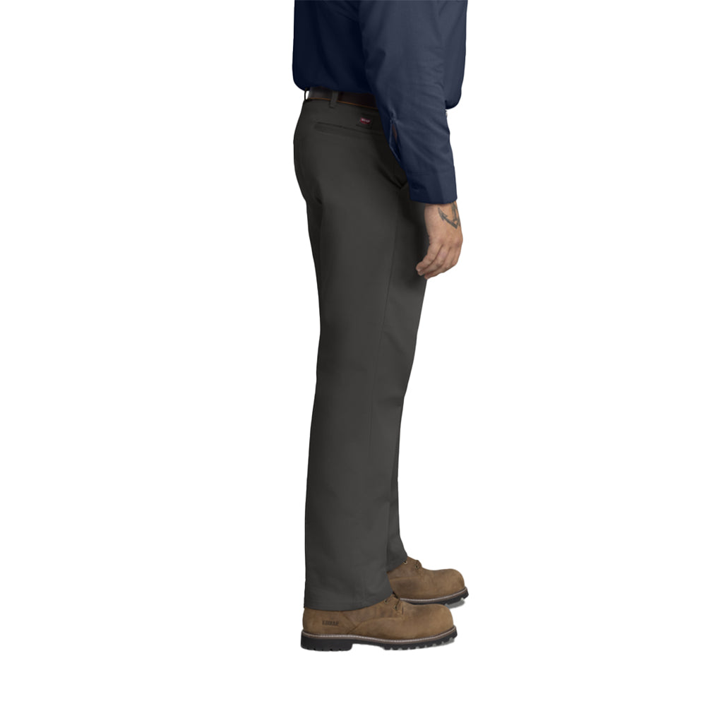 Person wearing dark gray pants and brown boots on a white background