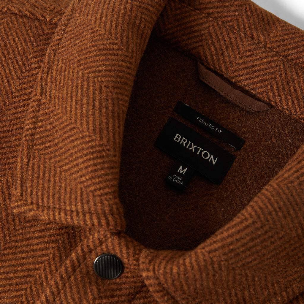 Brown textured fabric with a Brixton label on a white background