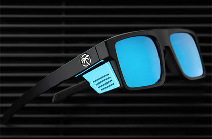 Black sunglasses with blue lenses on a black background