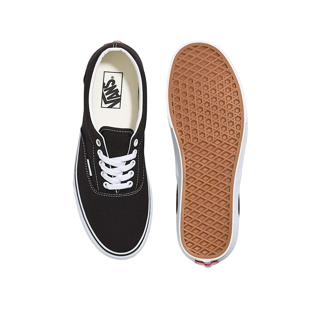 Black sneaker with white laces on a white background