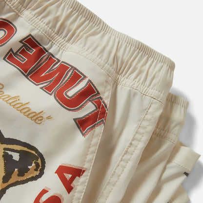 Beige shorts with red and black text on a white background