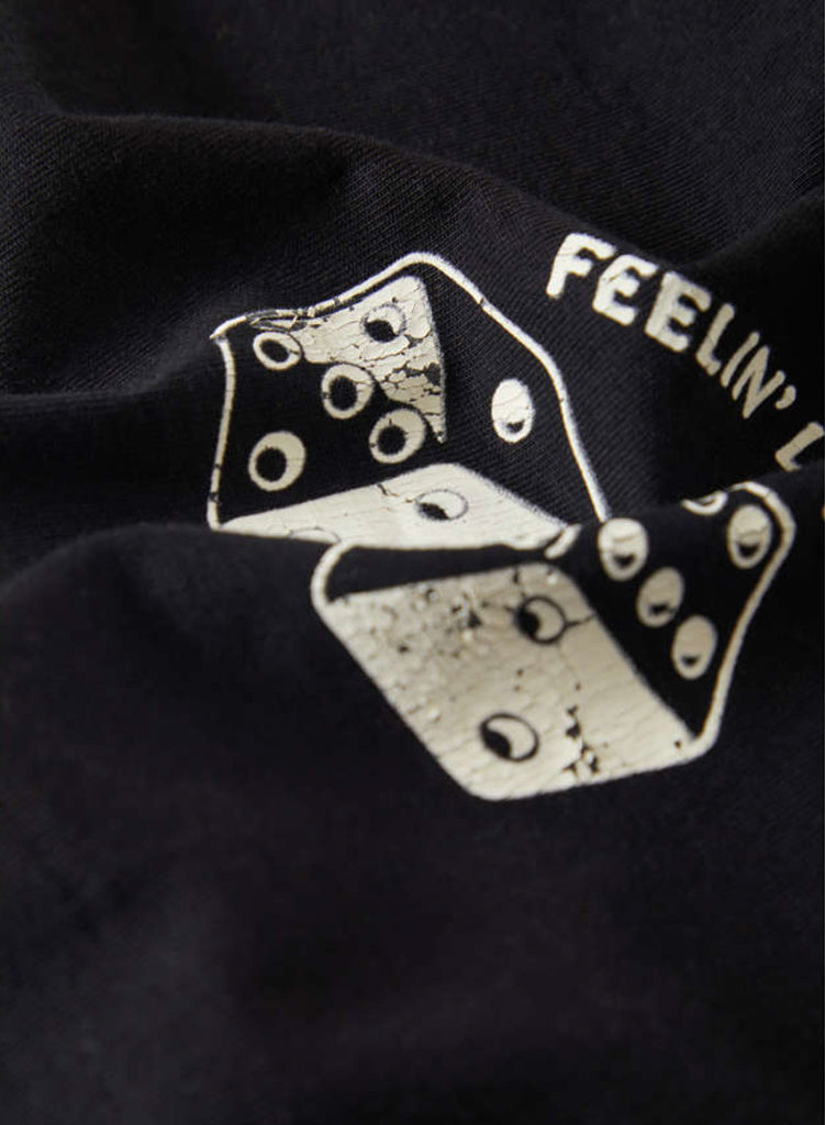 Black t-shirt with a white graphic design and text on a dark background