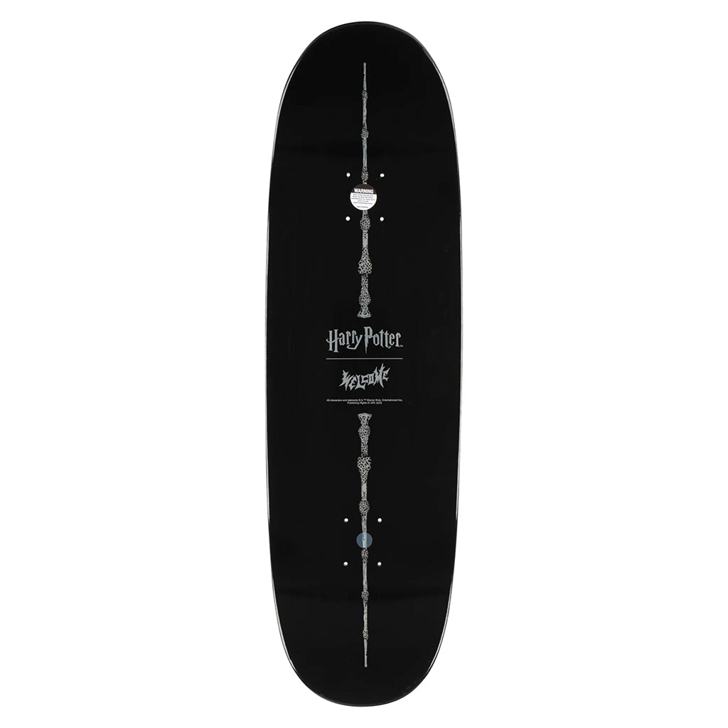 Black skateboard deck with silver designs and 'Harry Potter' branding on a white background
