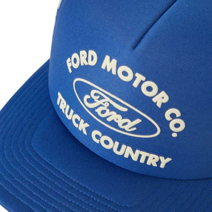 Blue cap with Ford Motor Co. branding on a white background