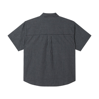 Black checkered short-sleeve shirt on a white background