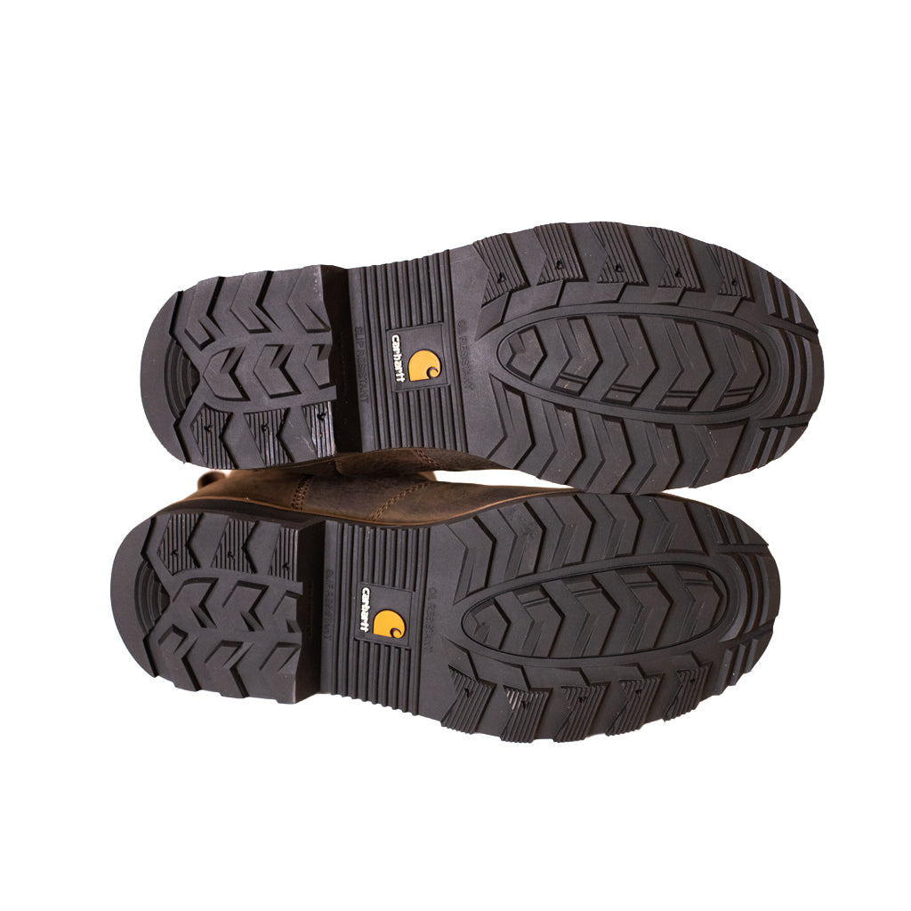 Pair of brown work boots with black soles on a white background