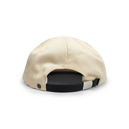 Beige cap with a black and white strap on a white background