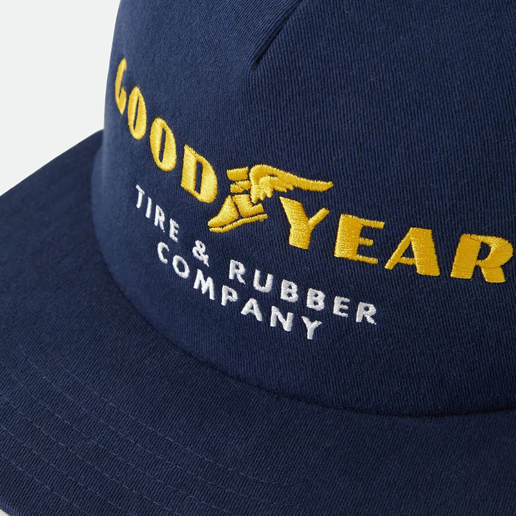 Navy blue cap with yellow and white embroidered text and logo on a white background