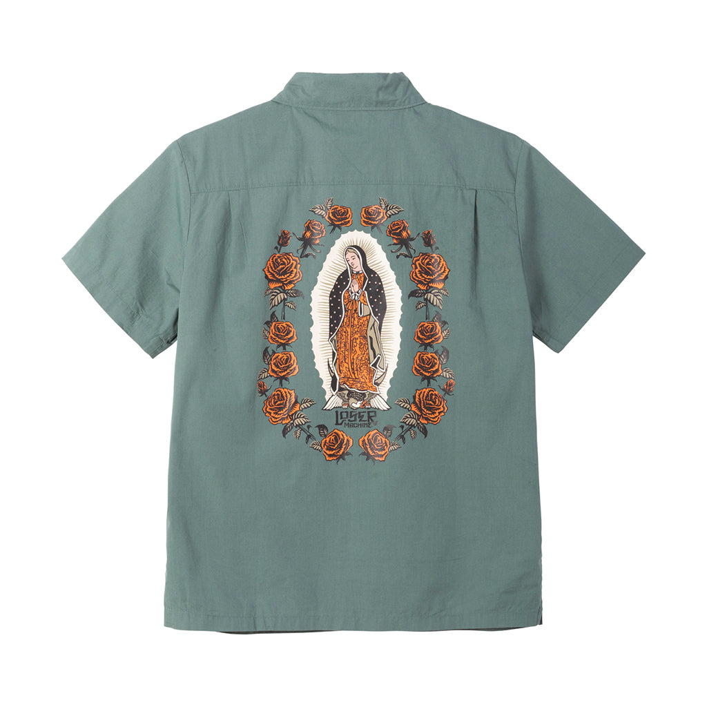 Green shirt with embroidered design of a religious figure and roses on the back