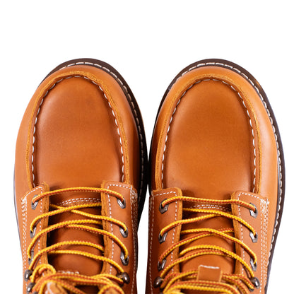 Pair of brown leather boots with yellow laces on a white background