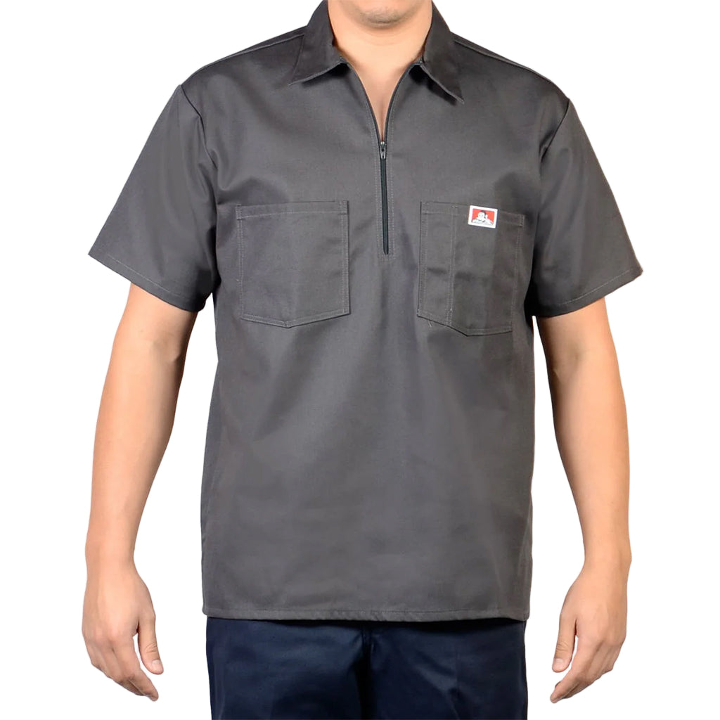 Gray short-sleeve shirt with a zipper on a plain background