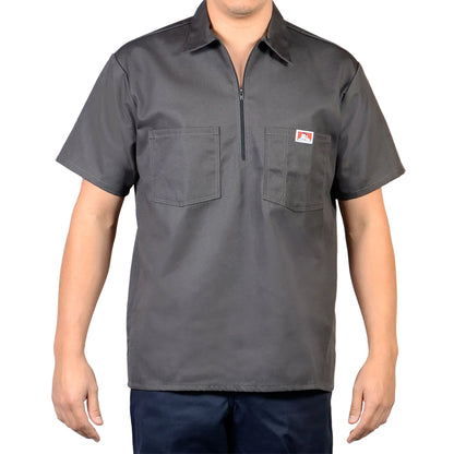 Gray short-sleeve shirt with a zipper on a plain background