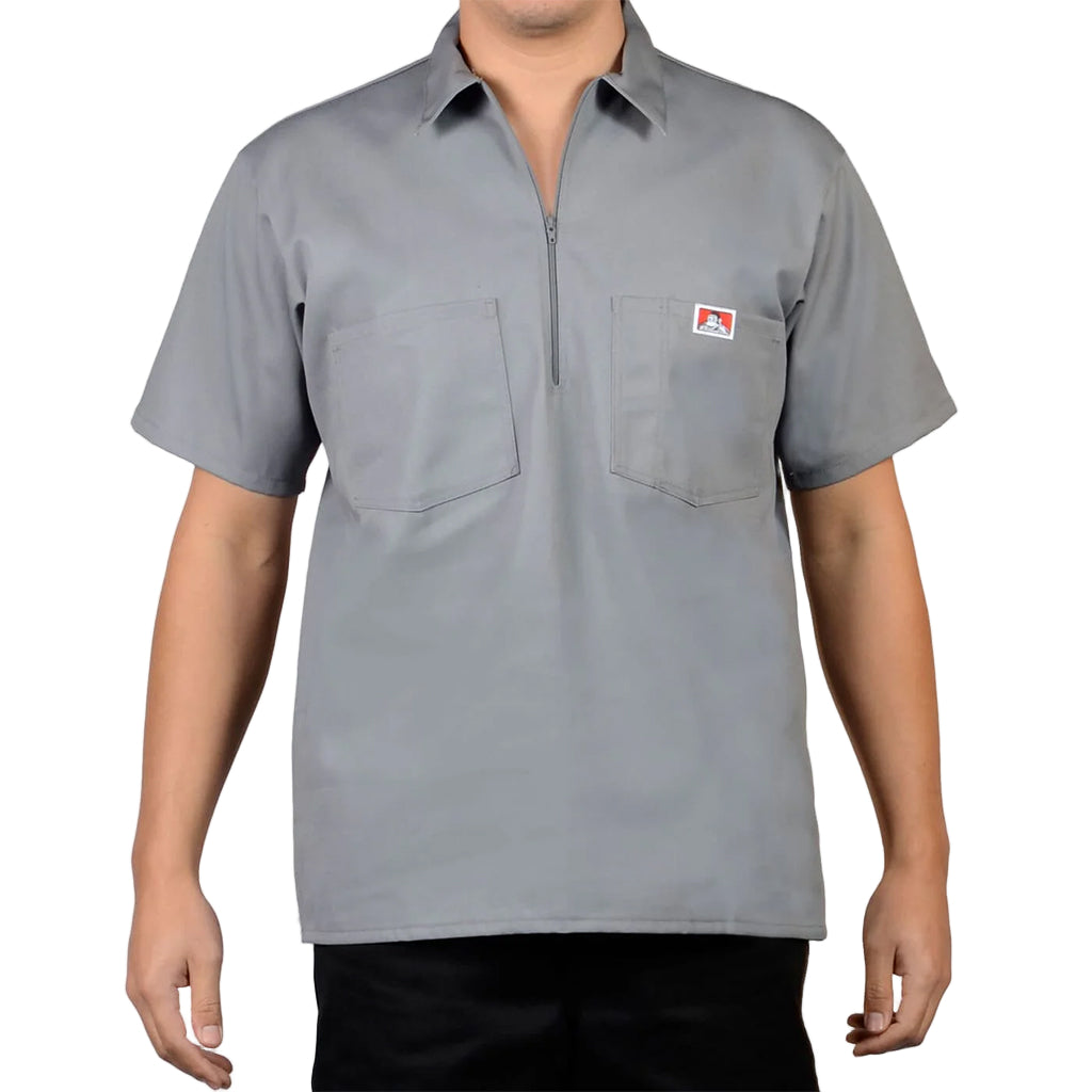 Gray short-sleeve shirt with a small logo on a plain background
