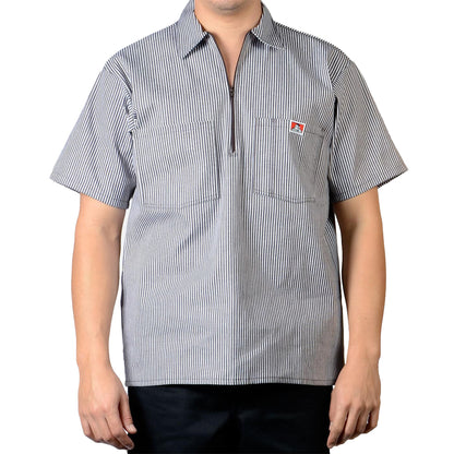 Person wearing a short-sleeve, striped brown shirt with a Ben Davis logo on a white background