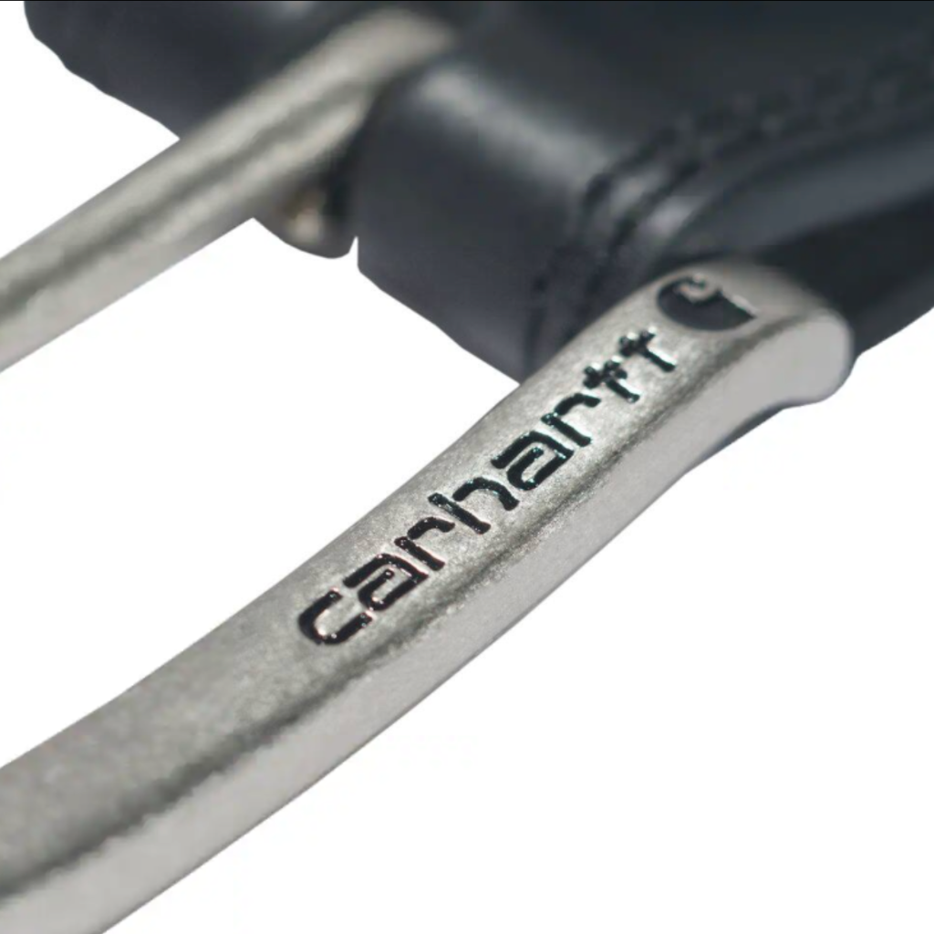 Close-up of a metallic silver Carhartt handlebar with the Carhartt logo engraved on it, attached to a black leather grip, on a white background.