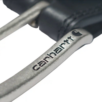 Close-up of a metallic silver Carhartt handlebar with the Carhartt logo engraved on it, attached to a black leather grip, on a white background.