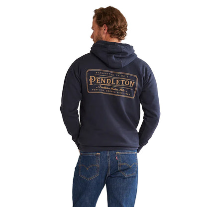 Person wearing a navy hoodie with Pendleton logo on the back, standing against a white background