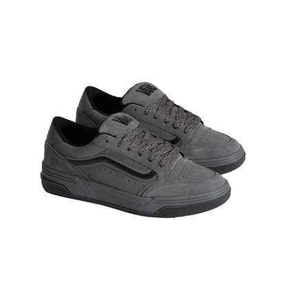 Gray sneakers with black accents on a white background