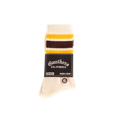 Sock with striped pattern and brand label on a white background
