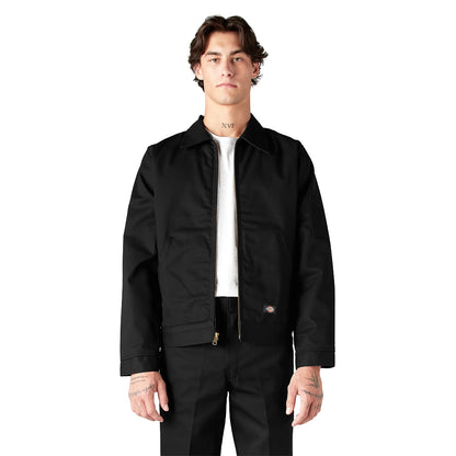 Person wearing a black jacket and pants on a white background