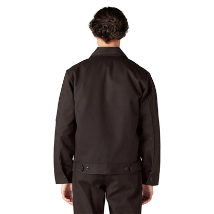 Person wearing a dark brown jacket on a white background