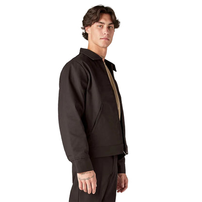 Man wearing a dark brown jacket and pants on a white background