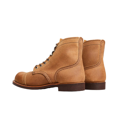 Brown leather boot on a white background