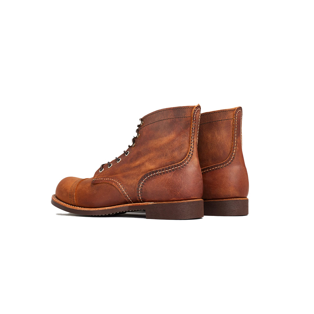 Pair of brown leather boots on a white background