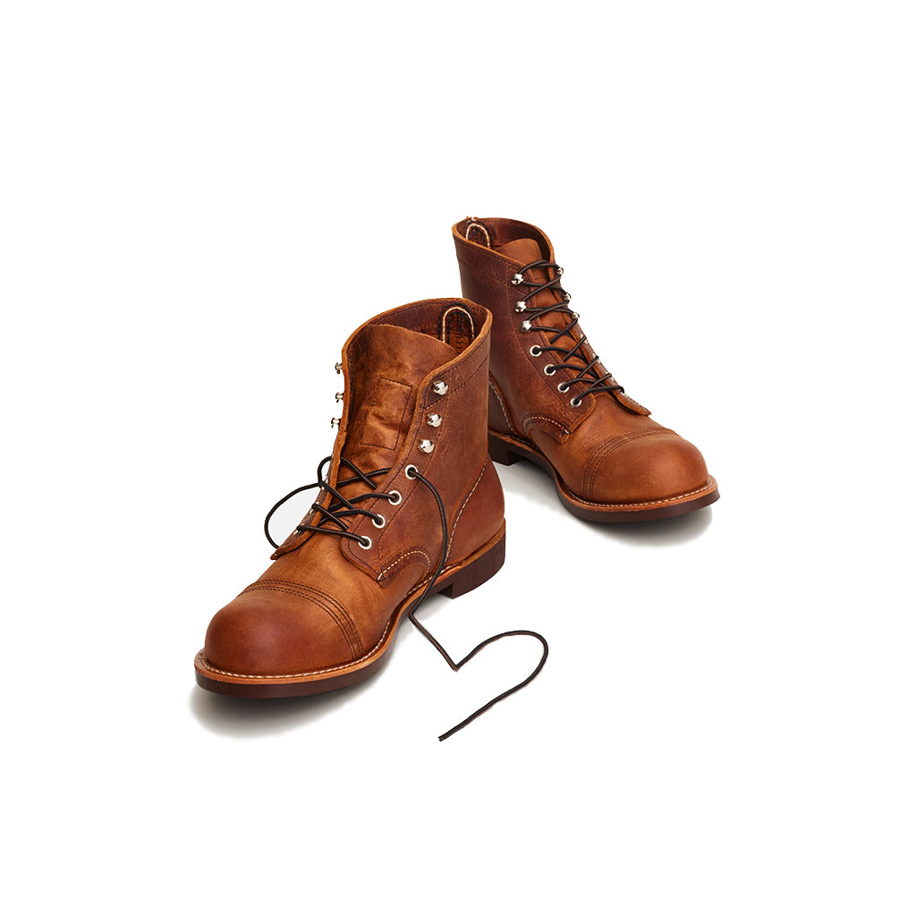 Pair of brown leather boots on a white background