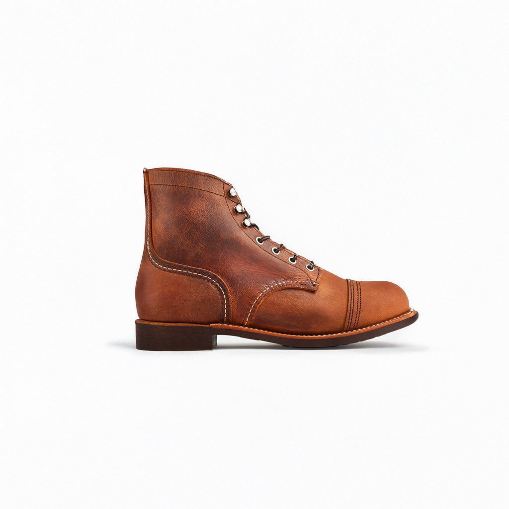 Brown leather boot on a white background