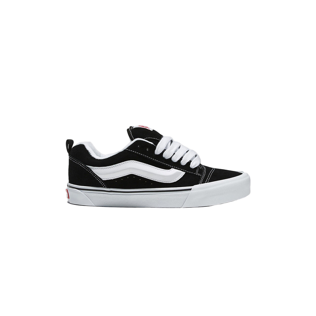 Black and white sneaker on a light gray background