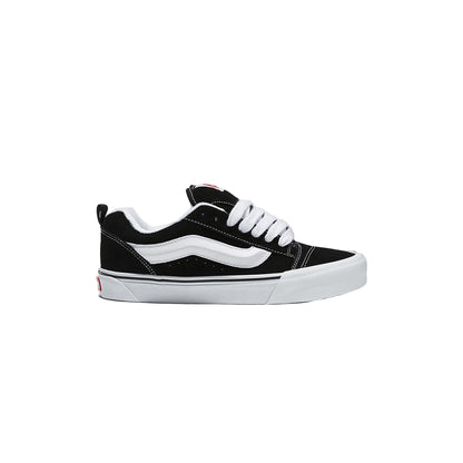 Black and white sneaker on a light gray background