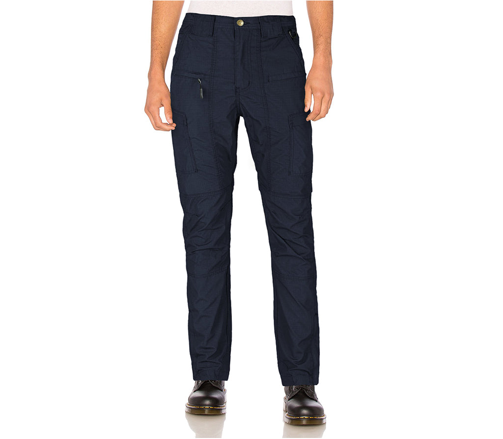 Navy pants worn by a person on a white background
