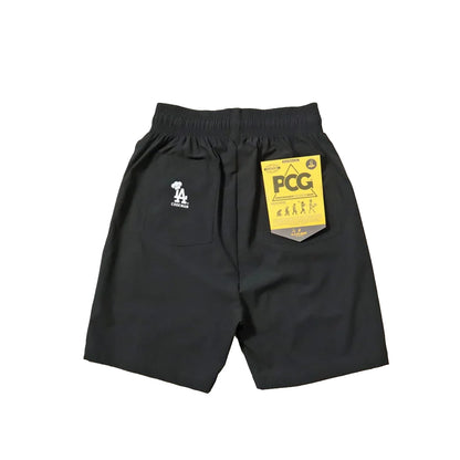 Black shorts with a yellow tag on a white background