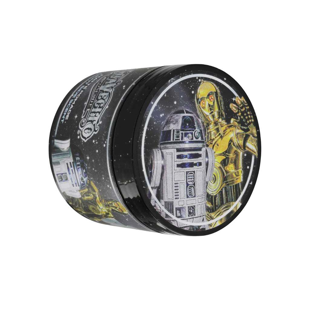 Tin with illustrations of R2-D2 and C-3PO on a white background