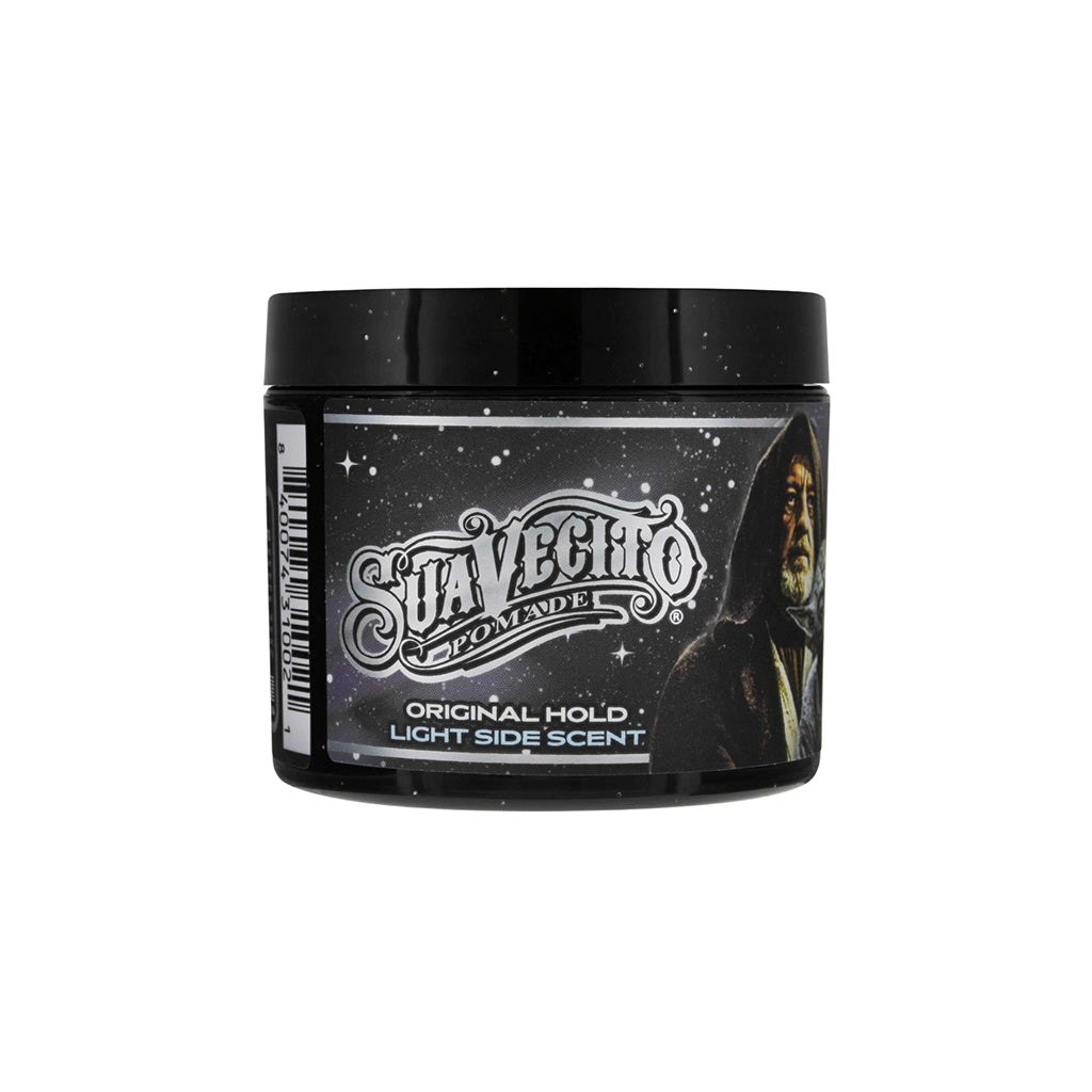 Black container of Suavecito Pomade with branding and product details on a white background