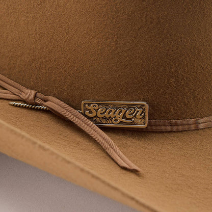 Brown hat with 'Seager' logo on a gray background