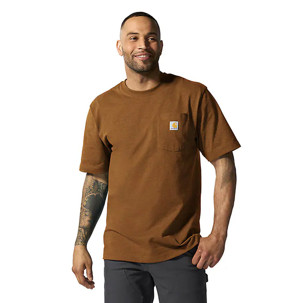 Man wearing a brown t-shirt with a pocket on a white background