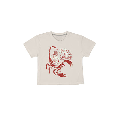 Beige t-shirt with red scorpion graphic and text on a white background