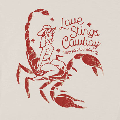 Illustration of a woman sitting on a scorpion with text 'Love Stings Cowboy' and 'Sendero Provisions Co'.