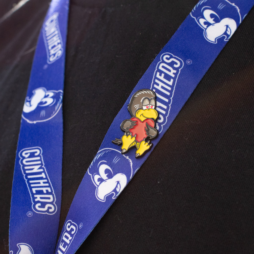 Blue lanyard with cartoon character and 'Gunthers' branding on a black background