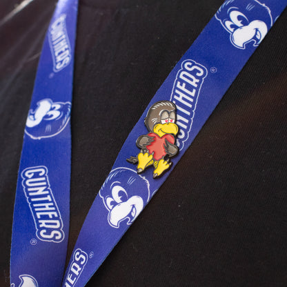 Blue lanyard with cartoon character and 'Gunthers' branding on a black background