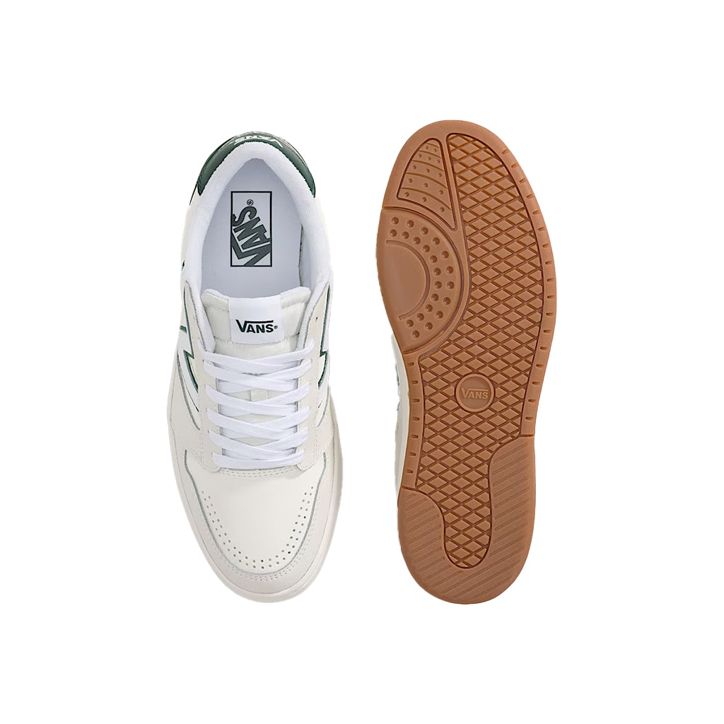 White sneaker with brown sole on a white background