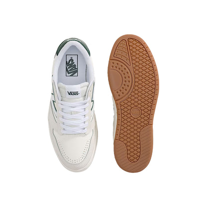White sneaker with brown sole on a white background