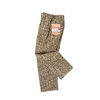 Leopard print pants with a brand label on a white background