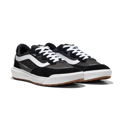 Black and white sneakers with brown soles on a white background