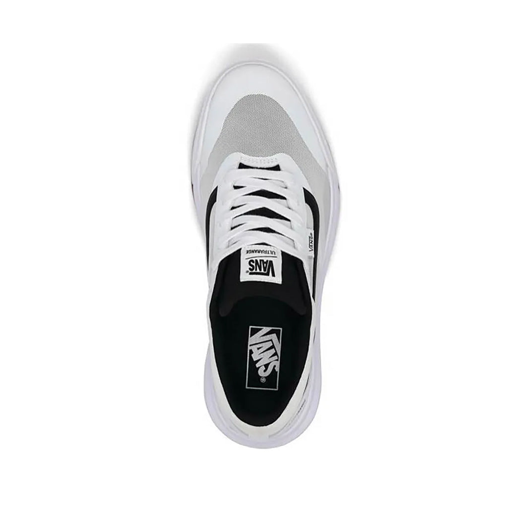 White and gray sneaker with black sole on a white background