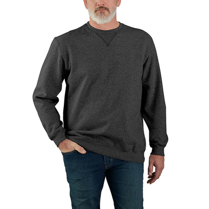 Man wearing a dark gray sweatshirt and blue jeans on a white background