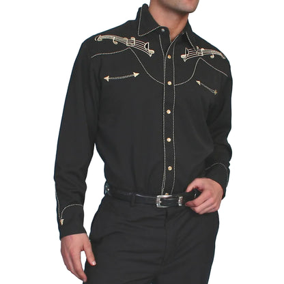 Man wearing a black western-style shirt with decorative elements on a white background