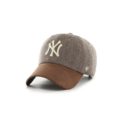 Brown and beige cap with a logo on a white background